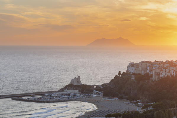 View of the sea village, the harbour and the tower of Sperlonga with Circeo mountain in the background at sunset, Sperlonga, Latina province, Latium, Central Italy, Italy, Europe