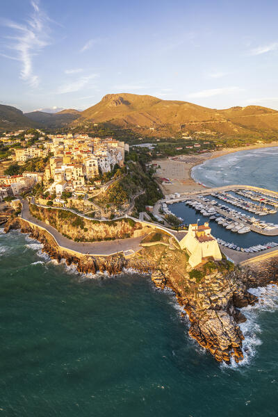 Aerial view of the old sea village of Sperlonga with the tower and the marina surronded by hills and mountains at sunset, Sperlonga, Latina province, Latium, Central Italy, Italy, Europe