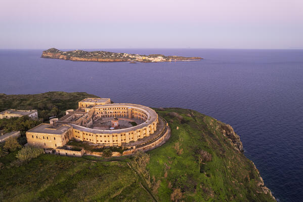 The panopticon prison on top of Santo Stefano Island with Ventotene island in the background at dawn , Santo stefano and Ventotene Islands, Pontine Islands archipelago, Tyrrhenian Sea, Latina province, Latium, Italy, Europe