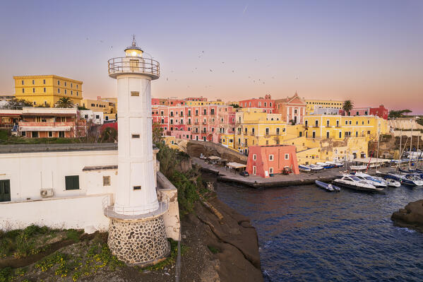 Aerial view of the colourful sea village of Ventotene with the lighthouse and the old roman harbour at dawn, Ventotene Islands, Pontine Islands Archipelago, Tyrrhenian Sea, Latina province, Latium, Italy, Europe