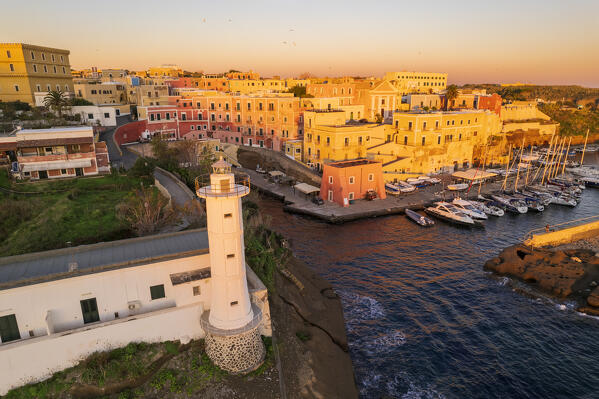 Aerial view of the colourful sea village of Ventotene with the lighthouse and the old roman harbour at sunrise, Ventotene Islands, Pontine Islands Archipelago, Tyrrhenian Sea, Latina province, Latium, Italy, Europe