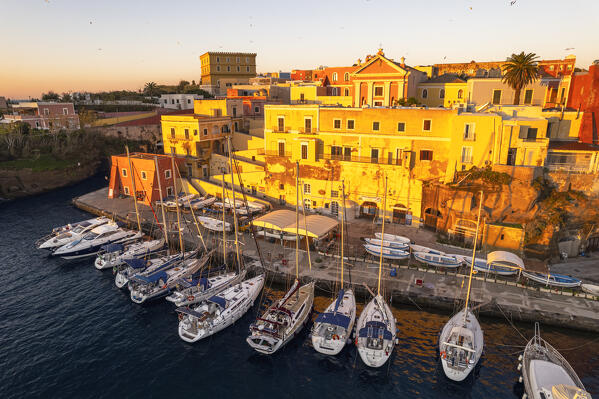 Aerial view of the roman harbour of Ventotene and the colourful houses on the marina at sunrise, Ventotene Islands, Pontine Islands Archipelago, Tyrrhenian Sea, Latina province, Latium, Italy, Europe