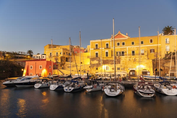 View of boats anchored in the water of the roman harbour of Ventotene village iluminated at dawn, Ventotene island, Pontine islands, Tyrrhenian sea, Mediterranean sea, Latium, central Italy, Italy, Southern Europe, Europe.