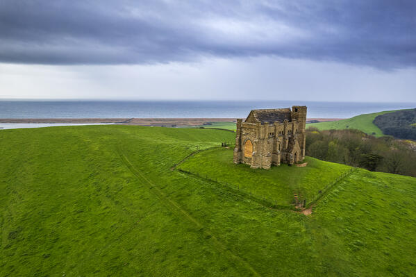 Elevated view of St Catherine's Chapel in green meadows in Abbotsbury, Jurassic Coast, UNESCO World Heritage Site, Dorset, England, United Kingdom, Europe