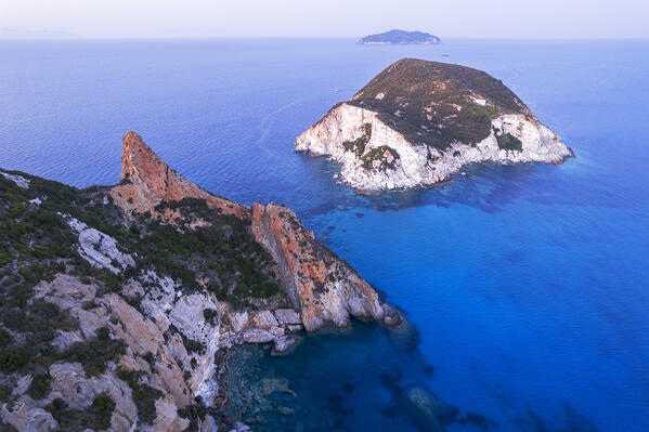 Aerial view of the white rocky tiny island of Gavi seen at dusk with Zannone island in the background, Ponza island, Pontine islands, Tyrrhenian Sea, Latina province, Latium, Italy, Europe