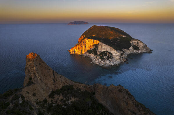 Sunset lit the white cliffs of the small island of Gavi and Zannone island in the background, aerial view, Ponza island, Pontine islands, Tyrrhenian Sea, Latina province, Latium, Italy, Europe