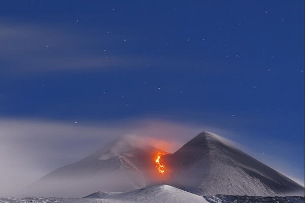 Night winter view of the Mount Etna eruption with the summit crater covered with snow, Piano Vetore, Regalna, Catania province, UNESCO World heritage Site, Sicily, Mediterranean Sea, Southern Italy, Italy, Southern Europe, Europe