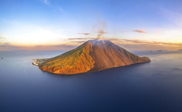 Panoramic view of Stromboli island with the smocking volcano seen from the drone at sunset, Stromboli island, UNESCO World Heritage Site, Aeolian Islands, Sicily, Tyrrhenian Sea, Mediterranean Sea, South of Italy, Italy, Southern Europe, Europe