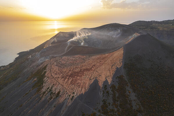 Sunrise over the volcanic landscape of the island of Vulcano with the big crater in the foreground, Vulcano island, Aeolian islands, Messina province, Sicily, Tyrrhenian Sea, Mediterranean Sea, South of Italy, Italy, Europe