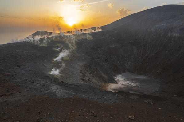 Volcanic gas emissions surrounding the big crater on top of the island of Vulcano at sunrise, Vulcano island, Aeolian islands, Messina province, Sicily, Tyrrhenian Sea, Mediterranean Sea, South of Italy, Italy, Europe