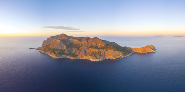Panoramic aerial view of the rocky island of Marettimo seen at sunset, Marettimo island, Favignana municipality, Trapani, Aegadian islands, Mediterranean Sea, Sicily, Italy