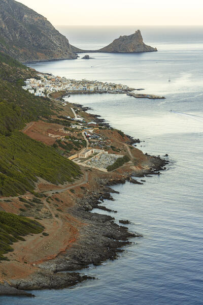 Fishing village of Marettimo with the rocky coast and the medieval castle (Punta Troia) in the background, Marettimo, Favignana municipality, Trapani, Aegadian islands, Mediterranean Sea, Sicily, Italy