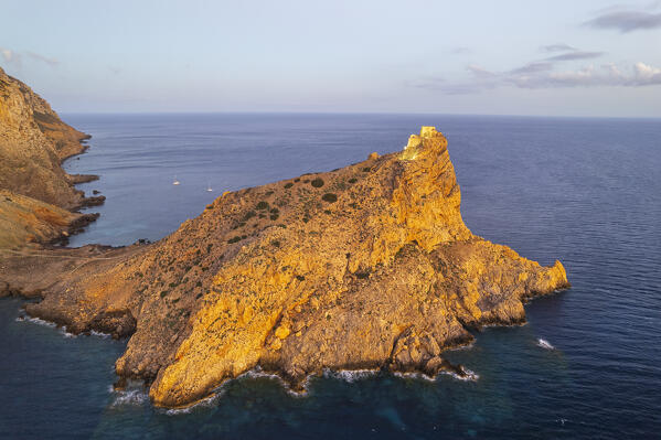 Fortress of Punta Troia on top of a cliff lit at sunset, Marettimo island, Favignana municipality, Trapani, Aegadian islands, Mediterranean Sea, Sicily, Italy