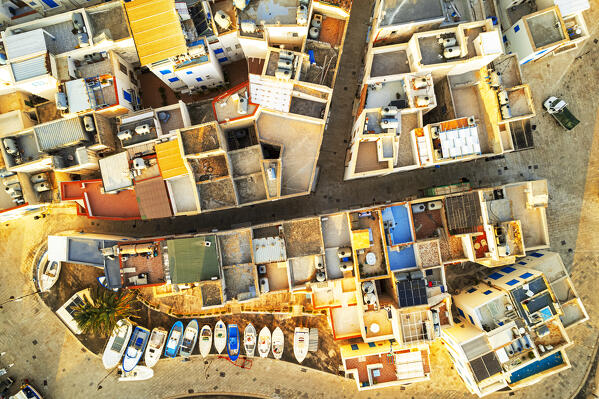 Overhead view of colorful cityscape of Marettimo island with boats along the roads of the village, Marettimo, Favignana municipality, Trapani, Aegadian islands, Mediterranean Sea, Sicily, Italy