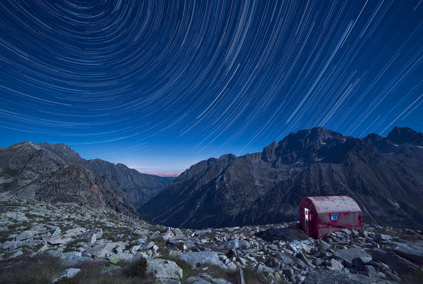 Italy, Piedmont, Cuneo District, Gesso Valley, Alpi Marittime Natural Park, Startrail over the bivouac Guiglia and Argentera Peak