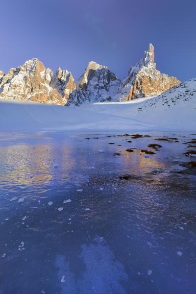 Pale di San Martino, Dolomites, Italy. Pale di San Martino at sunset reflected in the ice