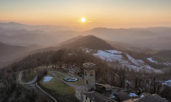 Winter aerial view of the castle San Lorenzo in the Alessandria hills at sunset. Pozzol Groppo, Alessandria province, Piedmont, Italy, Europe. 