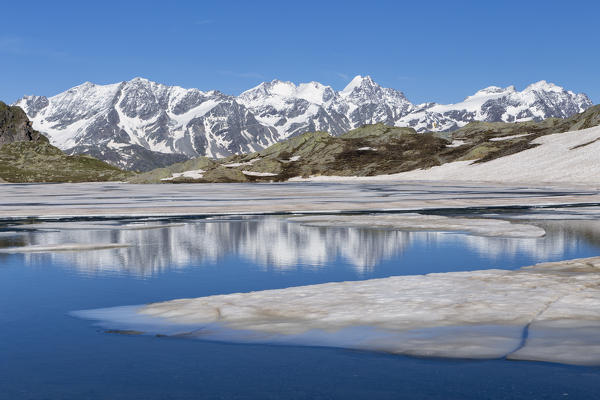 The ice is melting as summer approaches on this lake in Piz Lunghin, Switzerland
