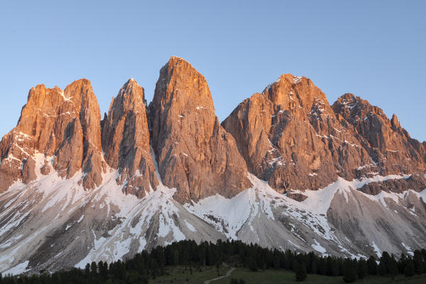 The Dolomites Eluminate the suns colour during sunset, Funes, South Tyrol, Italy 