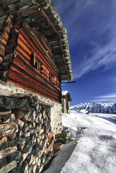 A typical mountain cottage in wintertime. Swiss alps, Switzerland