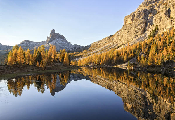The Beautiful Lake Federa reflecting Autumns colours, Dolomites, Veneto, Italy