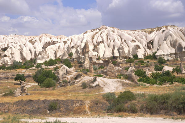 Part of region called Kappadokia in Turkey, you can see these fantastic formations called fairy chimneys. This particular area is near Uchisar in the middle of the street from Nevsehir and Goreme.