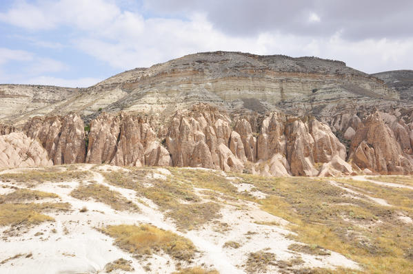 Fairy chimneys in the Lizilcukur valley in the Kappadokia region, Turkey. This part of Kappadikia is very beatiful with its pink and yellow colors.