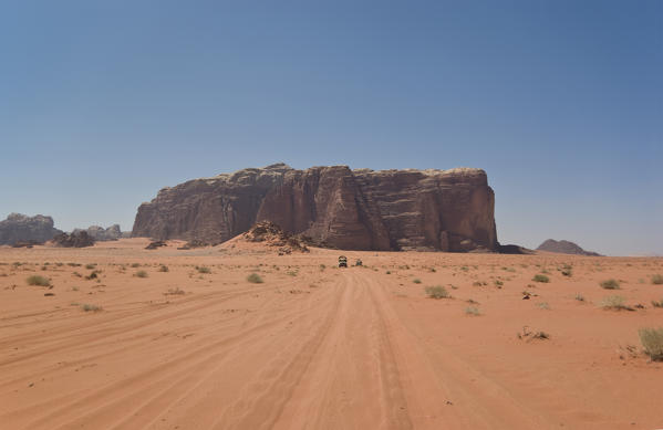 Mount Rum surrounded by the characteristic red sand is a destination for jeep tours operated by the local populations of the desert of Wadi Rum, Jordan