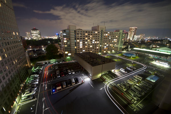 Parking the track of the car's headlights transiting during the night in a long exposur. Tokyo, Japan