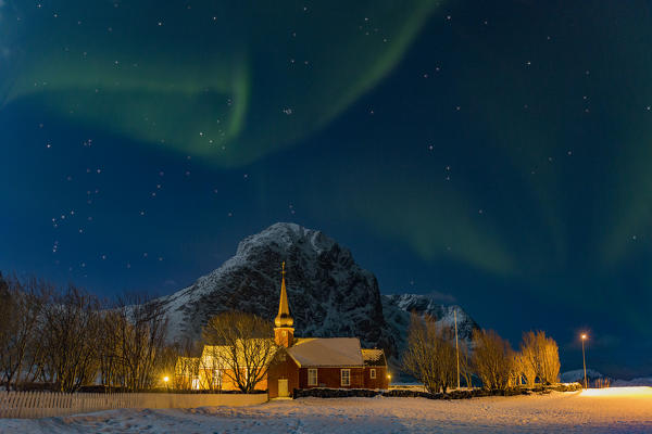 Northern lights (aurora borealis) over the Flakstad Kirke church, lofoten islands, nordland, norway, europe