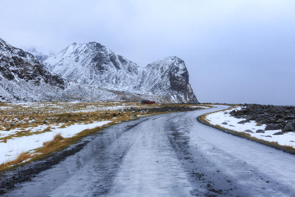 Iced road beside Unstad beach, lofoten islands, nordland, norway, europe