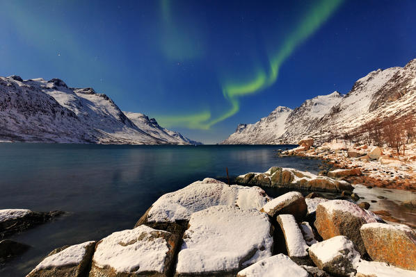 Aurora borealis (northern light) on Ersfjord, Troms, Norway, Europe