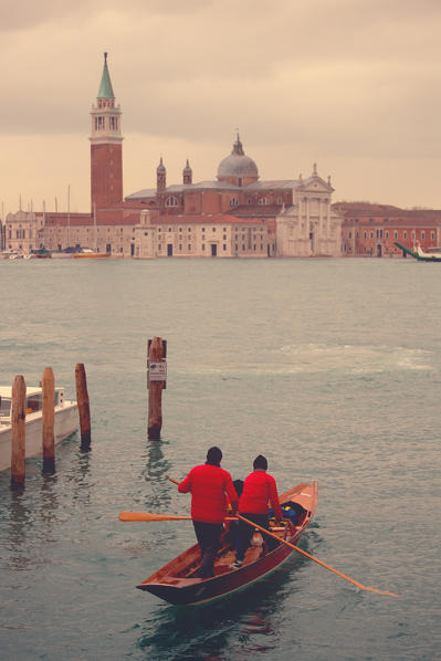 Europe,Italy,Veneto,Venice
Gondoliers masked sailing towards the canal of Venice