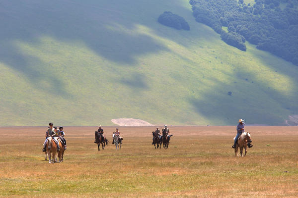 Europe,Italy,Umbria,Perugia district,Castelluccio of Norcia. Horse riding