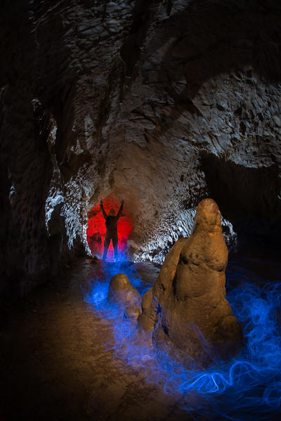 Speleologist exploring an italian cave