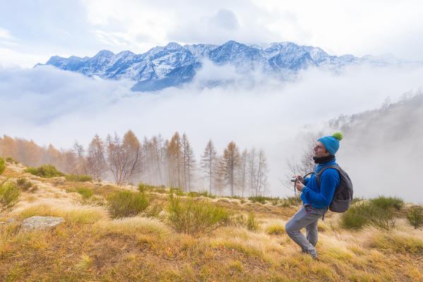 Hiker in Orco valley, Gran Paradiso National Park, Piedmont, province of Turin, Italian alps, Italy