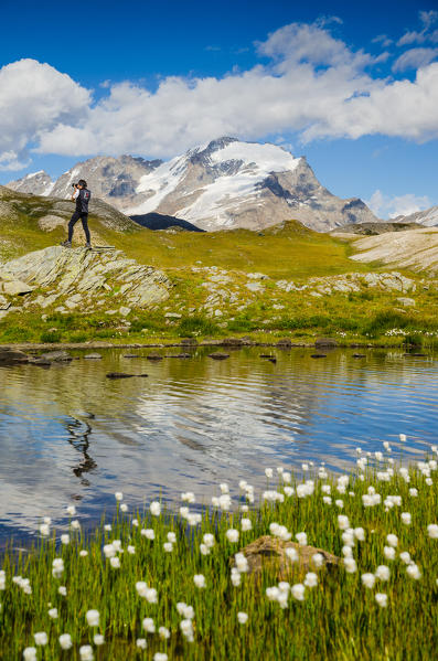 Photographer in front of Gran Paradiso (Valsavarenche, Gran Paradiso National Park, Aosta valley, Italy)
