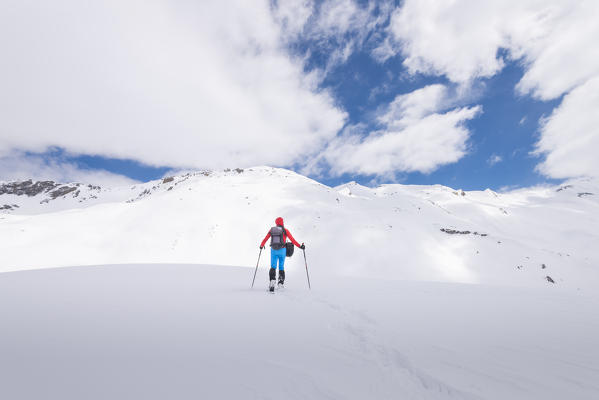 Hiker in front of Punta Palettaz, Val di Rhemes, Gran Paradiso National Park, Aosta Valley, Italian alps, Italy