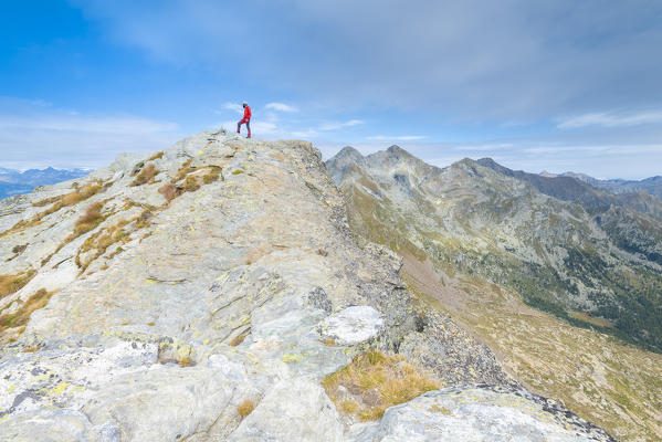 Alpinist on the summit of Mont Crabun, Lys Valley, Aosta Valley, Italian alps, Italy