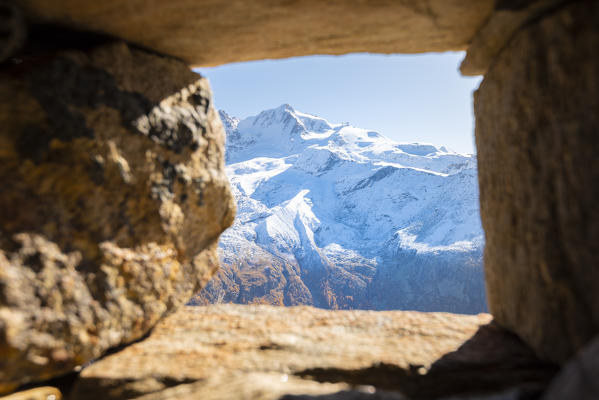 Gran Paradiso seen from inside a hut at Alpe Meyes, Valsavarenche, Gran Paradiso National Park, Aosta Valley, Italian alps, Italy