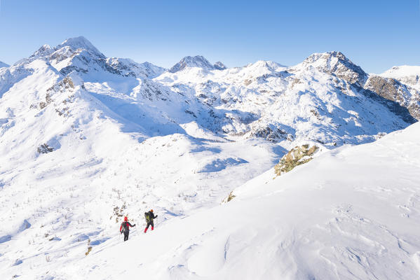 Hikers on Cima Piana, Champorcher valley, Aosta Valley, Italian alps, Italy
