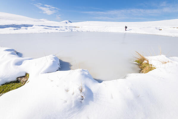 Frozen pond near Baita Cabretondo, Taleggio valley, Val Brembana, Orobie alps, Lombardy Italian alps, Italy