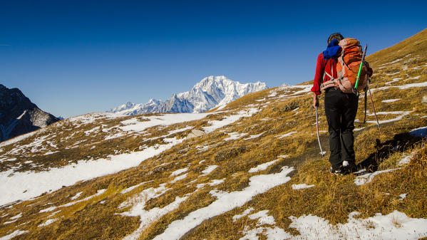 Alpinist in Malatra valley, Val Ferret, Aosta Valley, Italian alps, Italy