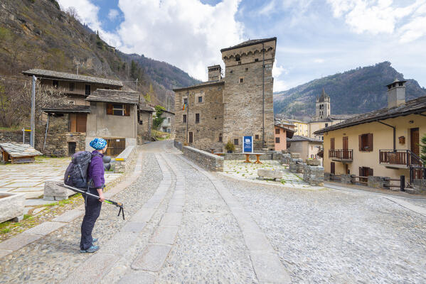 Hiker in the hamlet of Avise, Valle d Aosta, Italian alps, Italy