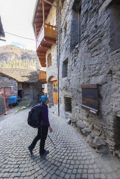 Hiker in the streets of Leverogne, Arvier, Valle d Aosta, Italian alps, Italy