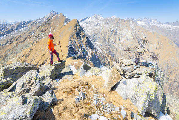 Alpinist on top of Punta Vallone, Valle Soana, Gran Paradiso National Park, Piedmont, Italian alps, province of Turin, Italy