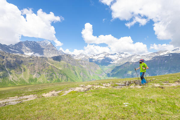 Hiker in Val Cairasca, Divedro valley, Ossola, province of Verbano Cusio Ossola, Piedmont, Italy