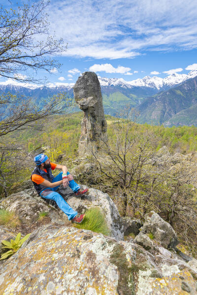 Mountaineer in front of the picturesque Flambeau d Arlaz monolith, Val d Ayas, Aosta Valley, Italian alps, Italy