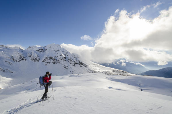 Photographer in Ayas Valley, Aosta Valley, Italian alps, Italy