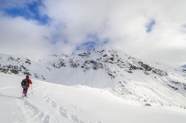 Hiker in wintertime (Ayas Valley, Aosta Valley, Italian alps, Italy)